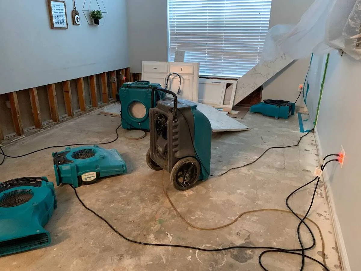 Dehumidifier in flood-cut room for Water Damage Restoration in Greeley